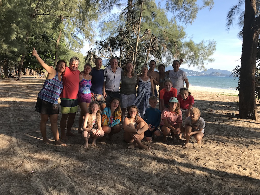 friends and family taking picture near the beach