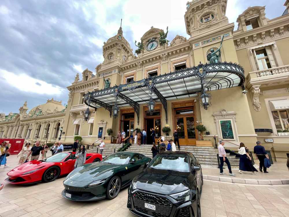front view of the old building with supercars in front - Things to do in Monaco
