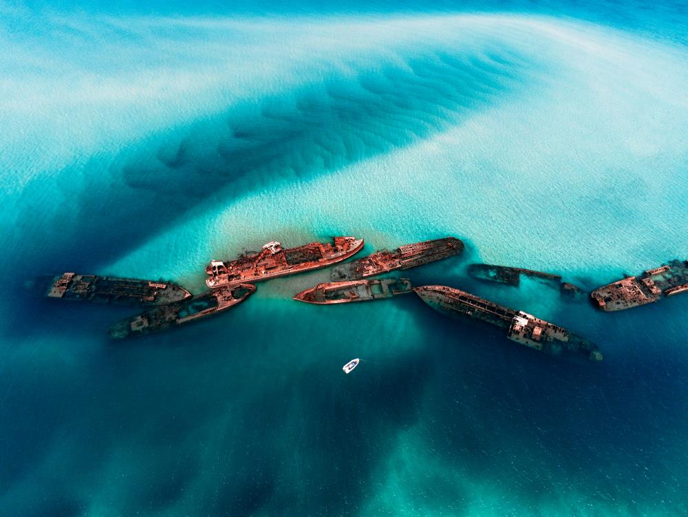 aerial view of wreck ship on blue sea