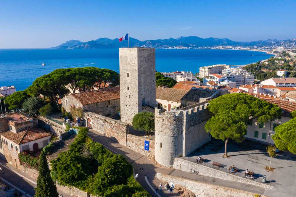 aerial view of the old brick building known as the Musée de la Castre near the ocean