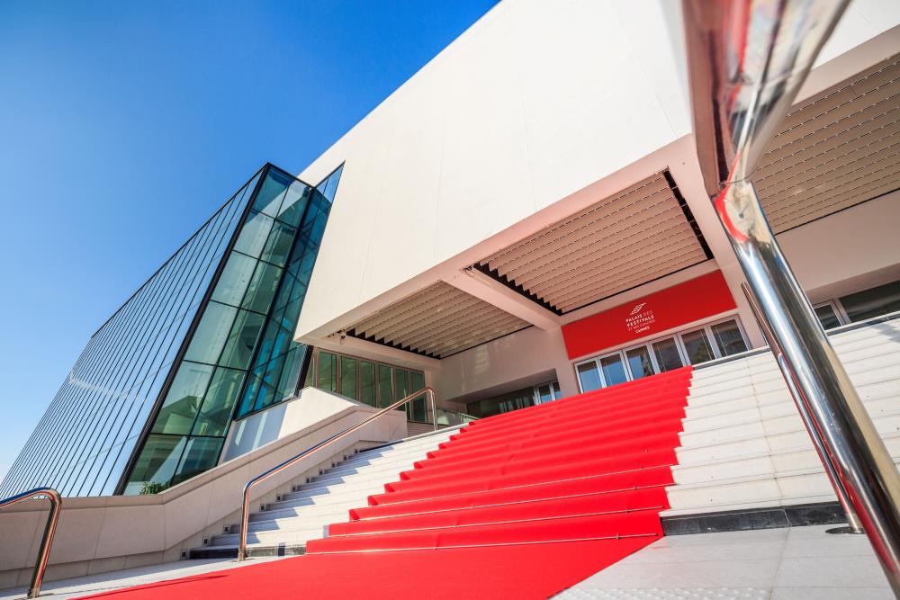 front view of the Palais des Festivals et des Congrès showing red carpet of the stairs