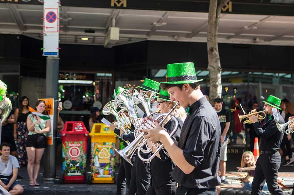 a band playing a marching tune during the st patrick's day parade in san francisco