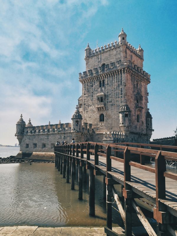 old building structure tower anear body of water
