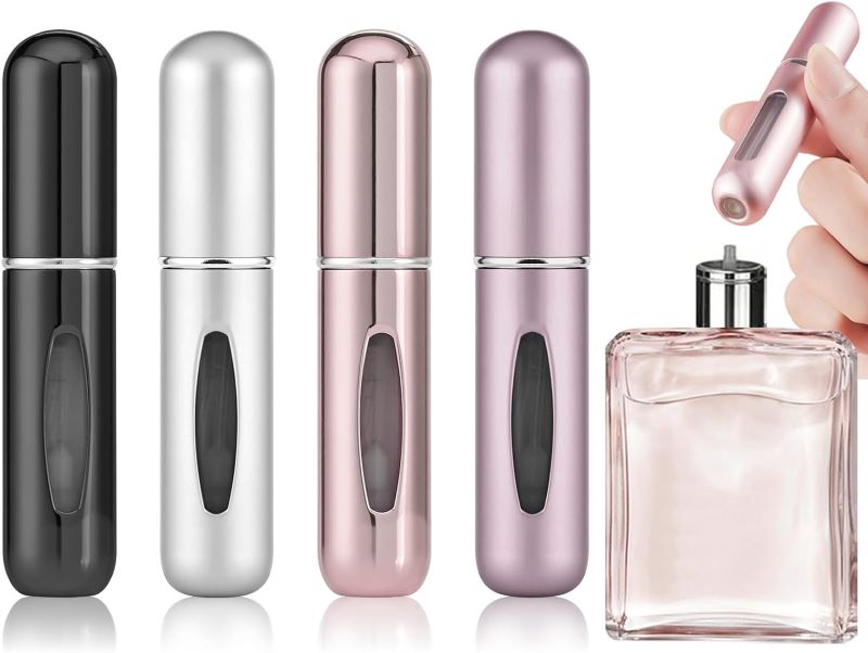 4pc of black, white, rosegold and pink Portable Mini Refillable Perfume Atomizer Spray Bottle. One is used and pump in a perfume